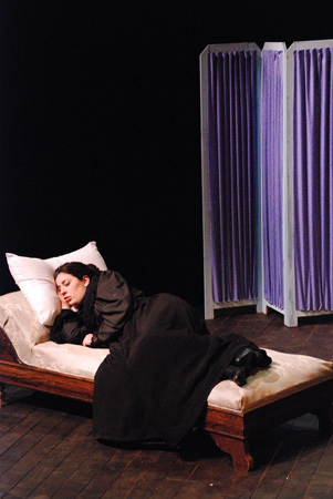 a woman laying asleep on a chaise lounge