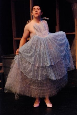 a man wearing a dress and heels