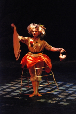 a woman standing with arms outstretched like she's dancing