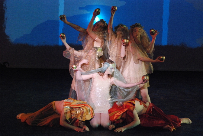 five women covered in veils holding golden apples, 2 men laying at their feet